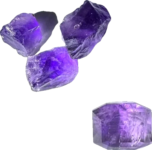 Rough amethysts and one cut stone